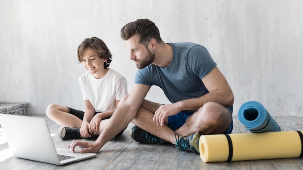kid-his-father-doing-sport-home